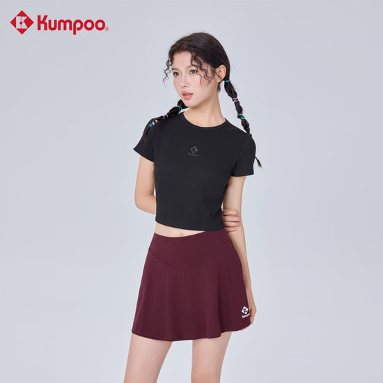 Kumpoo K261W-7182 women's skirt with a stylish design, shown on a model, featuring a comfortable fit and elegant length.