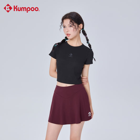 Kumpoo K261W-7182 women's skirt with a stylish design, shown on a model, featuring a comfortable fit and elegant length.