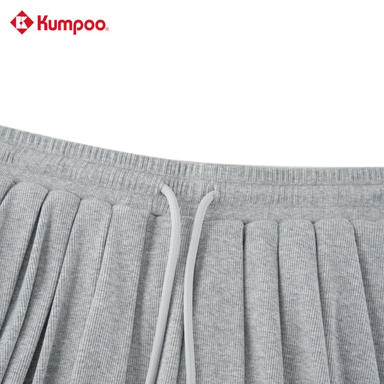 Kumpoo women's sports skirt for badminton, pickleball, and tennis, made of lightweight performance fabric, shown on a model.