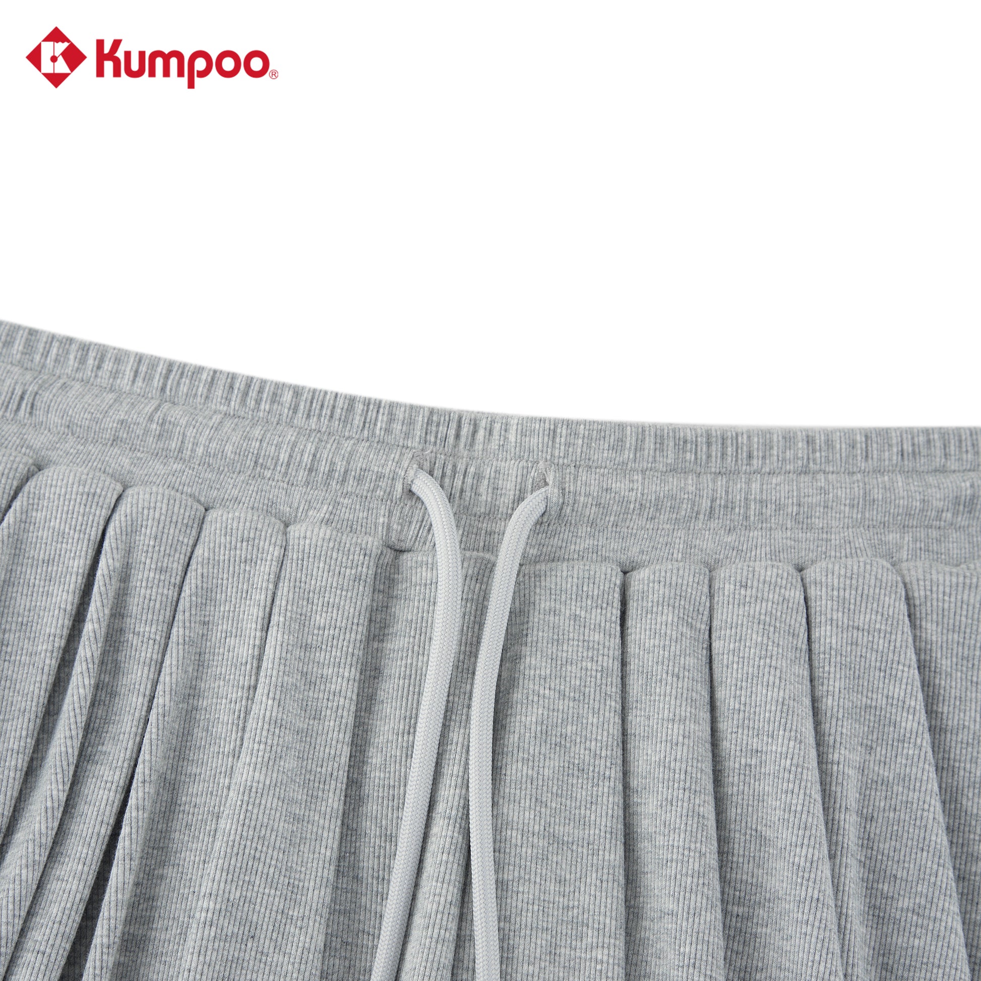 Kumpoo women's sports skirt for badminton, pickleball, and tennis, made of lightweight performance fabric, shown on a model.